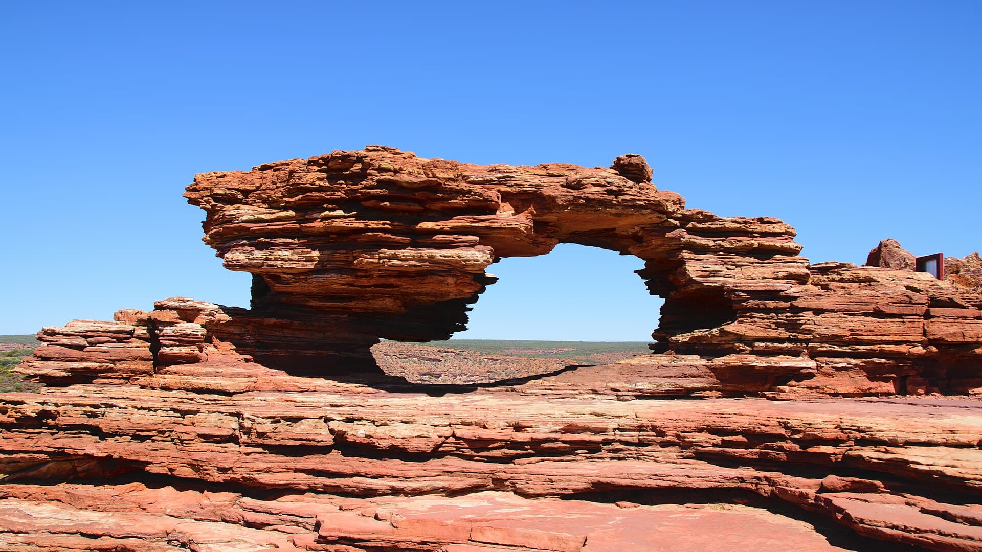 Wide view through Nature’s Window over banded sandstone and the Murchison River